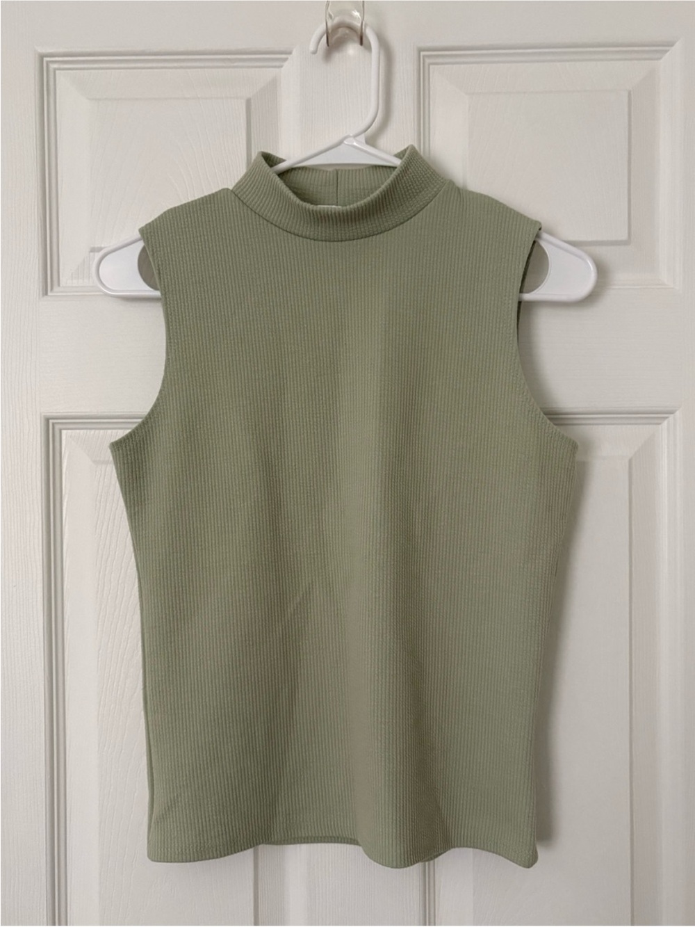 green sleeveless mock neck top